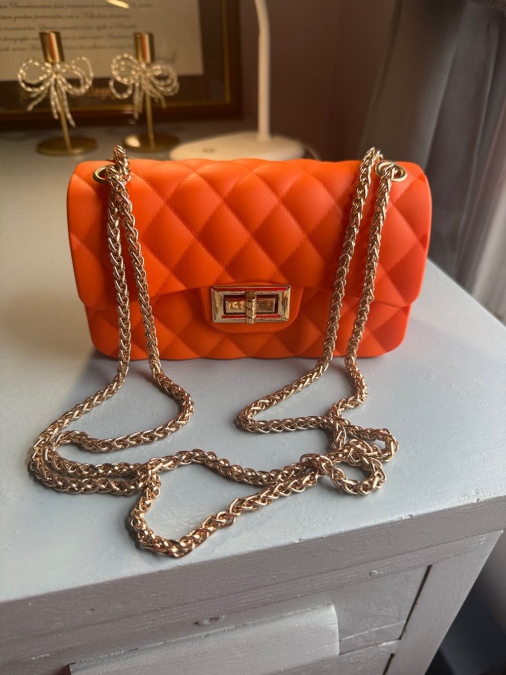 Rubber Quilted Orange Bag with Gold Chain Strap